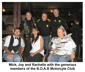 Mick, Joy and Rachelle with the generous members of the BOAB Motorcycle Club at the Black and White Night at Daly Waters Pub